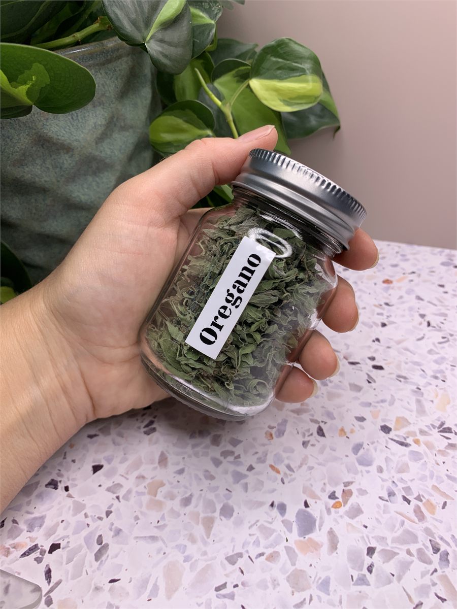 A jar of dried oregano.