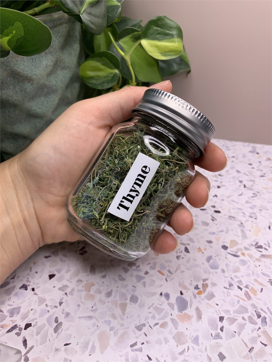 A jar of dried thyme.